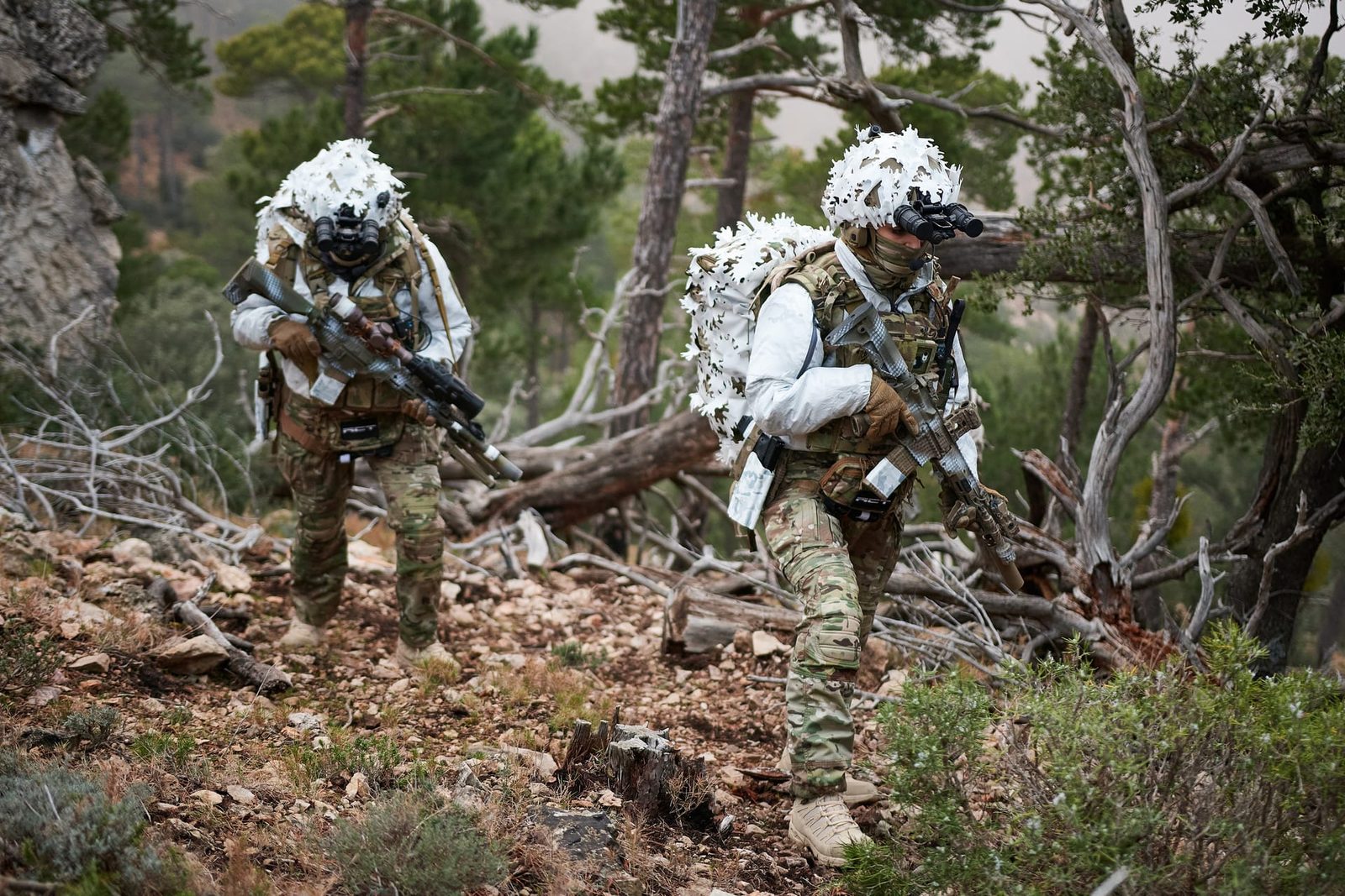 Operators traversing rocky terrain